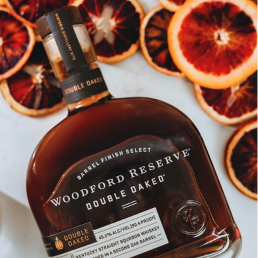 Woodford bourbon surrounded by grapefruit slices